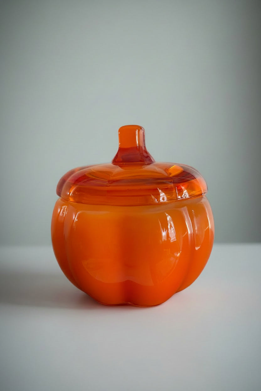 Orange Pumpkin Caramel candle in a decorative pumpkin-shaped glass jar