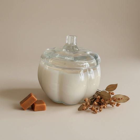 White Pumpkin Caramel candle in a decorative pumpkin-shaped glass jar